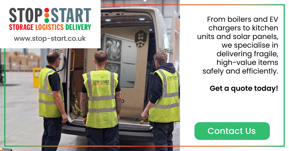 photograph of some of the stop start team carefully loading up a stop start van with an air conditioning unit ready for nest day delivery